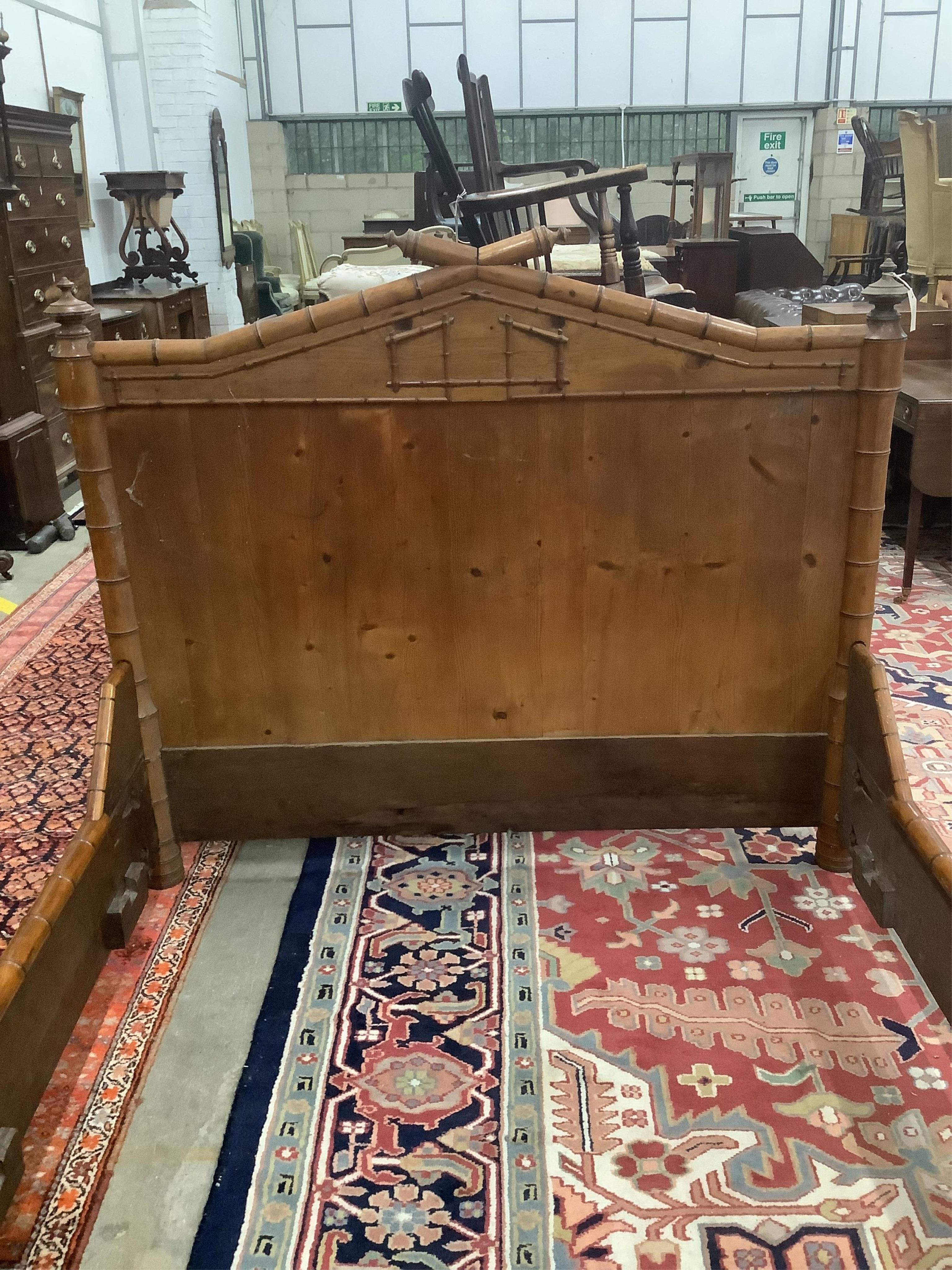 A 19th century French pine faux bamboo double bedframe, width 150cm, length 190cm, height 130cm. Condition - fair